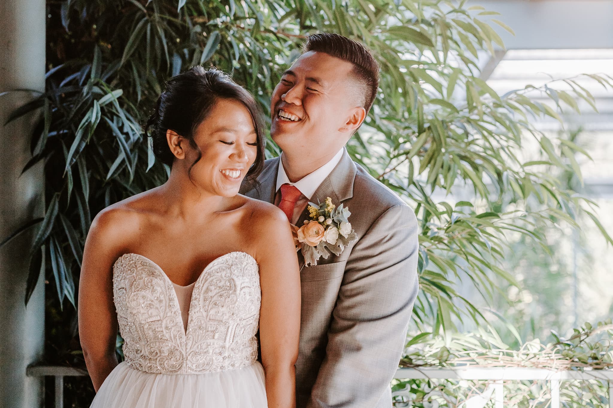 Couple laughing on their wedding day